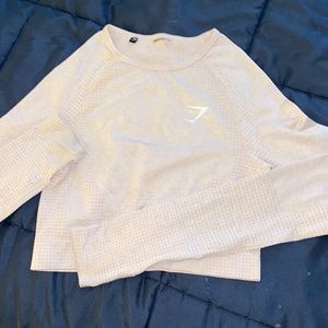size small gymshark long sleeve crop top. very light pink